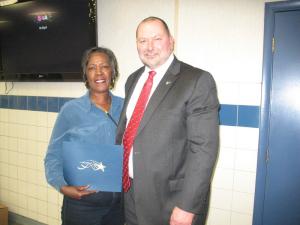 Barbara Milbourne, with 10 years of service, accepts her certificate from KSI CEO Craig Crouch. SOURCE SUBMITTED