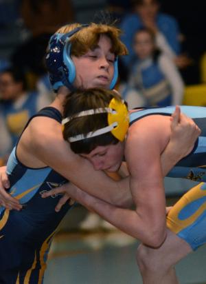 Beacon's Timmy Kelley works for the pin over Mariner's Jimmy McMullen at 2:29 of the 106-pound class. BY DAN COOK
