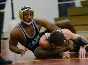Cape's J.J. Currie cranks Sallies' 152-pounder Dane Diksa to a 4-1 victory. Currie came in second in the tournament. BY DAN COOK
