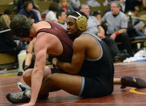 Cape's Justin Lopez wrestles to an 18-3 tech fall over Kenny Vanvorst from Milford. Lopez took second-place honors in the tournament. BY DAN COOK
