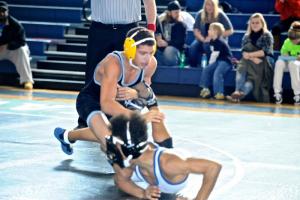 Dante Jaquet, 126, eventually lost his match, but the freshman never stops getting after the other guy. BY DAVE FREDERICK