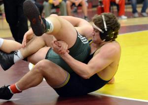 Cape senior Aaron Mattioni grapples with Indian River's Jake Troublefield and wins a 5-2 decision in the 195-pound class. BY DAN COOK