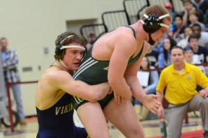 Cape senior Aaron Mattioni grapples with Indian River's Jake Troublefield and wins a 5-2 decision in the 195-pound class. BY DAN COOK