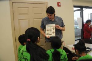 Delaware Nature Society Manager Jason Beale shows the types of fish that live in the different water quality environments the children tested in their experiments. BY STEVEN BILLUPS