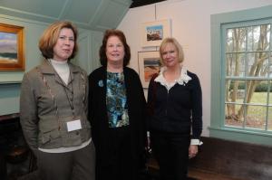 Enjoying the art in the Homestead Gallery are (l-r) RAL Campaign Manager Ellen Wise, Claire Ingley and Helen Schneck. Ingley’s photo, “Rehoboth Surf Breaking on the Rocks,” is in the background. BY STEVEN BILLUPS