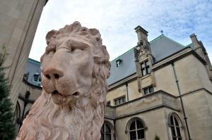 Lions guard the entrance to Biltmore. As many as 1 million people tour the mansion each year. BY RON MACARTHUR