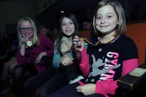 Showing their Academic Excellence medals are (l-r) Emma Allen-Riely, Dru Buehler and Leonora Demerutis. BY STEVEN BILLUPS