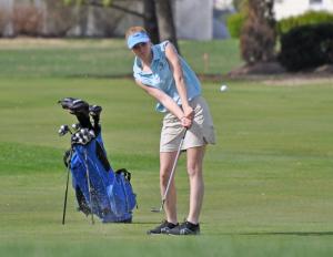 Cape junior Rachel Hagan pitches a shot from just off the ninth green. Hagan competed in an alternate match versus the Ravens. BY NICK ROTH