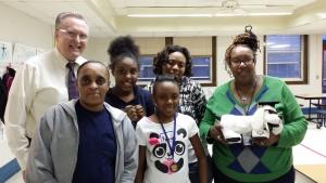 Attending the year's final Strengthening Families Program are in back (l-r) MES Principal Kevin Mumford, student Ny’Asia Floyd, and parent Marquita Floyd. In front are parent Jacqueline Floyd, student Ki’Arah Floyd, and Children & Families First supervisor Hattie Bull. SOURCE SUBMITTED