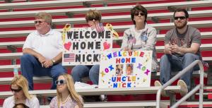 Dover residents (l-r) Michael Little Jr., brother; Loretta Walls, aunt; Lisa Rossi, mother; and Riley McCallister, friend, are on hand to support SPC Nicholas Little. His wife and newborn were waiting at home. BY DENY HOWETH