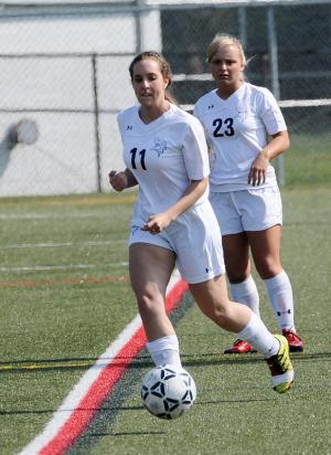 Cape senior Catherine Burton moves the ball into the Vikings' offensive side of the field. BY DAN COOK