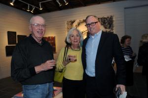 Enjoying the social atmosphere at the opening are (l-r) Al Rosin, Cookie Kerxton and Jonathan Willen. BY STEVEN BILLUPS