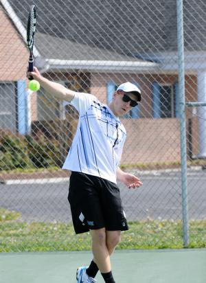 Cape second singles player Evan Lesko powers a topspin backhand drive in the 6-0, 6-0 win over Clay Satterfield. BY DAN COOK
