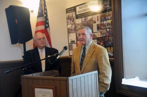 Prior to the ribbon cutting, County Councilman Sam Wilson presents a check to HGA's Martin Donovan. A tribute from senators Gerald Hocker, Ernie Lopez and Brian Pettyjohn was read by Patricia Anderson, Senate consultant liaison. BY STEVEN BILLUPS