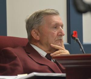 Sussex County Councilman Sam Wilson listens as speakers criticize comments he made during and after a May 13 meeting. BY RON MACARTHUR