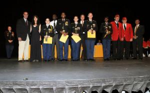 The LCPL Chad Clifton Memorial Award is presented to the Best Leader-Staff in the Unit. Shown are (l-r) Senator Ernie Lopez, Terri Clifton, Staff Officer Amber Cluesman, Spencer Brittingham, Platoon Leader Jevon Sample, Platoon Sgt. Jennifer Stirrup, Bob Fulton, Assistant Platoon Sgt. Josh Steiner, Squad Leader Jade Jefferson, Ernest Swanson and Evertt Beach from Marine Corps League and Representative Smyk. BY STEVEN BILLUPS