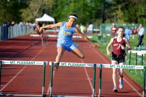 Annie Judge runs and wins her first 300 hurdles before heading into her lacrosse career. BY DAVE FREDERICK