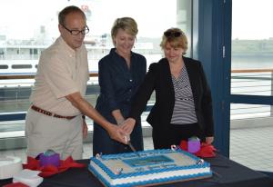 Ronald Goldstein, President of the Chamber of Commerce of Greater Cape May, Vicki Clark, President of the Cape May County Chamber of Commerce, and Kathy Louderback, Second Vice President of the Lower Township Chamber of Commerce cut the MV Delaware’s birthday cake following the brief ceremony. BY DRBA