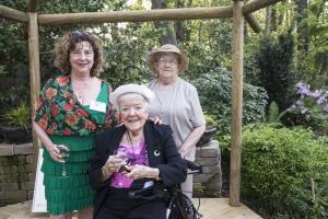 Enjoying the new pergola on the Zajics' property are (l-r) Sheryl Swed, vice president DBG; Susan Marlowe and Janice VanGunda . BY DENY HOWETH