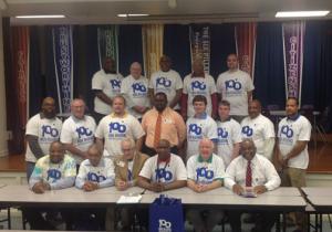 The readers gather for a group photo prior to being assigned to classrooms. Shown standing in back are (l-r) Murphy Marbury, Dover; John Jackson, Milford; Ralph Lee, Bridgeville; Larry Savage Milton; and Andrew Syzmanski, Lincoln. In the second row are Chris Lee, Greenwood; Rober Craig, Harrington; Chad Lingenfelder, Georgetown; Willian Collick, Milton; Brian Werkheiser, Rehoboth; Hunter Proudfoot, Milford; Bill Duffy, Millsboro; and Kevin Solomon, Dover. In front are Nathaniel Bolden, Seaford, Robert Drains, Millsboro; Grant Curtis, Lincoln; Greg Fuller, Lincoln, Joe Conaway, Bridgeville; and Bill Collick, Milton.