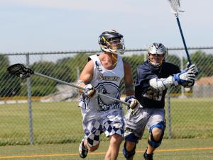 Former Wesley stand out and Cape coach Dave Mushrush clears the ball for the Starboard squad. BY DAN COOK