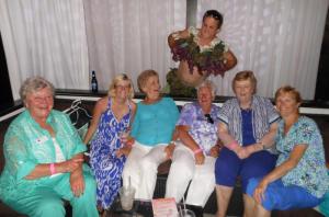 Blair Cherico, in his Heard It Through the Grapevine bra sponsored by Ocean Atlantic Sotheby's International Realty, works his magic on (l-r) Barbara Brittingham, Stacey Dill, Myra Mock, Helen Foti, Carol Brannan and Vickie Voll. BY CHRIS FLOOD