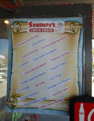 A poster on Shrimpy's door shows the wide variety of foods offered at the new establishment. BY CHRIS FLOOD