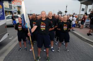 Standing ready for the Law Enforcement Torch Run are members of the Delaware State Police Training Academy led by William Wallace, recruit class president. BY STEVEN BILLUPS