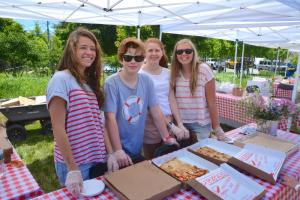 Serving Half Full pizza are (l-r) Deborah Marini, Will Bulton, Claire Sullivan and Sydney Boright. BY RON MACARTHUR