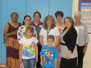 Long Neck Elementary Terrific Kids first-grade winners of Explorer LeapPad2 tablets are joined by their teachers and Kiwanis members. In back are (l-r) Kiwanis members Audrey Smith, Lisa Simmons, Marianne Smith and Jonnie Mann; middle row, teacher Sloan Welsh, teacher Donna Waller and Kiwanis member Millie Charnick. In front are students Alisha Tilton and Thomas Thompson. Not pictured is teacher Martha DeWire. SOURCE SUBMITTED