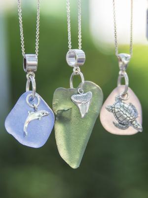 Just Beachy Keen sea glass pendants are host to silver creatures. BY DENY HOWETH