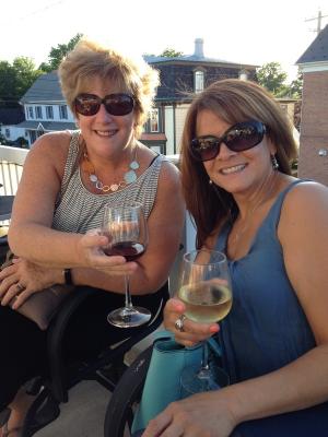 Zaida Guajardo, left, and Kathy Lougheed of Burton Realty share a toast to the Boys & Girls Club of Georgetown. BY DENY HOWETH