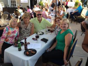 Enjoying the sounds of Carbon 14 are (l-r) Linda Sullivan, Angie and Clayton Townsend, Linda Price of Fulton Bank, and Debbie Hartstein, of Insurance Market. BY DENY HOWETH