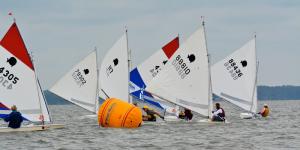 Sunfish sailors round a mark during one of seven races on Rehoboth Bay during the Mid-Atlantic Sunfish championship. BY RON MACARTHUR