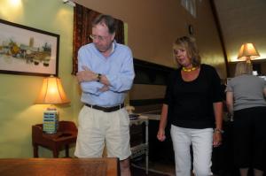 Phil Lapard of Seaford examines a Burle Walnut Partners Desk shown by Barbara Pew of Barbara Pew Art. BY STEVEN BILLUPS
