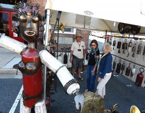 The Steam Emporium artist Ed Kidera creates steampunk style art, shown here talking with Marian Sandmaier and Cathy Gray, right. BY DENY HOWETH