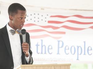Darien Jones, a Morehouse College graduate, reads an excerpt from John F. Kennedy' speech of June 19, 1963. BY DENY HOWETH