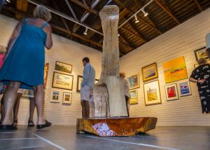 A woodsSculpture by Roy Fitzgerald rests in the center of the gallery as a chair; the wood is from the grounds of the RAL. BY DENY HOWETH