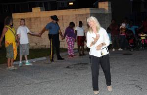 The Rev. Pat Loughlin of Epworth United Methodist Church prays for the people in attendance and for the West Rehoboth Community. BY DAN COOK