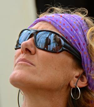 The myriad of rigging on the Kalmar Nyckel is reflected in trainee Janet Blondi's sunglasses. BY RON MACARTHUR