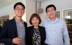 Pathology specialist Dr. Xiaoli Chen is flanked by her sons, left, Michael Sun and James Sun.
