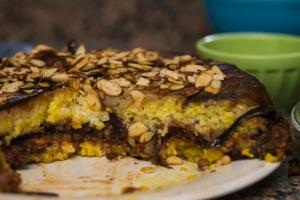 Armenian layered eggplant cake consisting of roasted eggplant, lentils, mushrooms, peppers and turmeric jasmine rice.