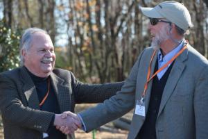 DBG Vice President Ray Sander, left, welcomes Dennis Forney of the Sussex Land Trust, thanking him for the organization’s foresight in preserving the tract. Forney is also the publisher of the Cape Gazette.