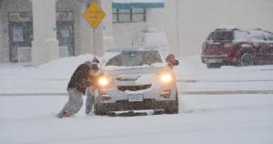 A stuck motorist on Route 1 near Rehoboth Beach gets some help to get his car moving. RON MACARTHUR PHOTO