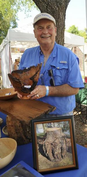 Larry Taylor shows his newest and most interesting piece made from a 1,000 pound piece of cherry burl from a farm in Millersville.