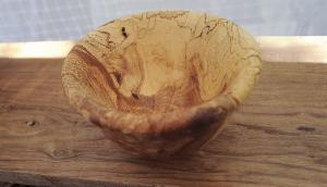 A spalted wood and oak bowl. Spalting is any form of wood coloration caused by fungi. Although primarily found in dead trees, spalting can also occur in living trees under stress.