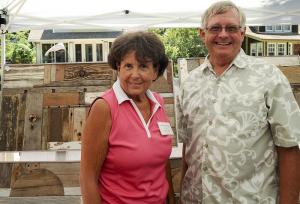Event Coordinator Cindy Foster shares Gary Crowl’s tent for some relief from the sun.