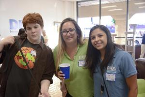 Volunteer Sam Gardner (l-r), Volunteer Coordinator Michelle Iorii and Stephanie Gomez, animal marketing and adoption event coordinator, gather for a photo.