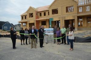 A ribbon cutting was held at the Patriot Series at Heritage Creek. Shown in back are Chris Clark, warranty tech; Carol Gephart, Fernmoor director of sales and marketing; Ed Gomes, project manager; David Steele, Fernmoor project manager; Guy Waites, Delaware sales; Chris Nichols, Seascape president; Kelly Nichols, assistant property manager; Neil Richard, property manager and Doug Nichols, property manager. In front, Veronica DeCrescio, marketing coordinator; Art Lodge, senior vice president and chief lending officer Applied Bank; Jeffery Fernbach, Fernmoor Homes president; and Cayla Wiener, senior account manager, Oxford Communications. Fernmoore Homes