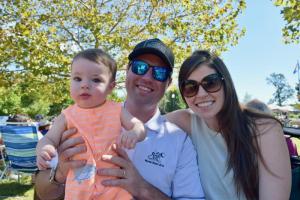 Relaxing on a park bench are the Veirs family of Rockville, Md., (l-r) 8-month-old Benjamin, Cliff and Abby.